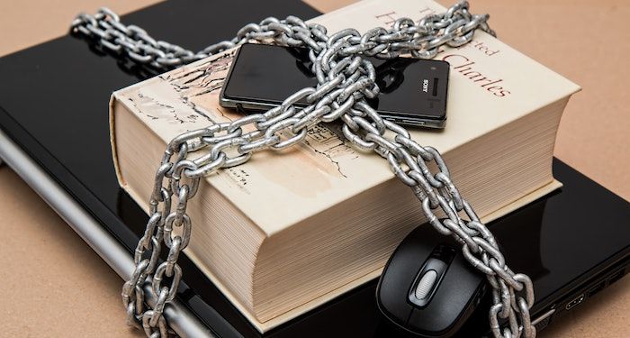 chained book and laptop.jpg.optimal