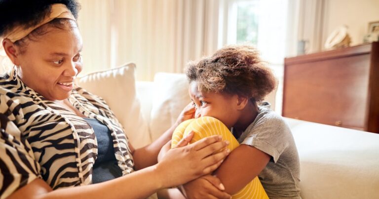 young african mother consoling