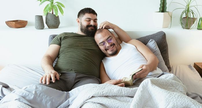 men reading in bed.jpg.optimal