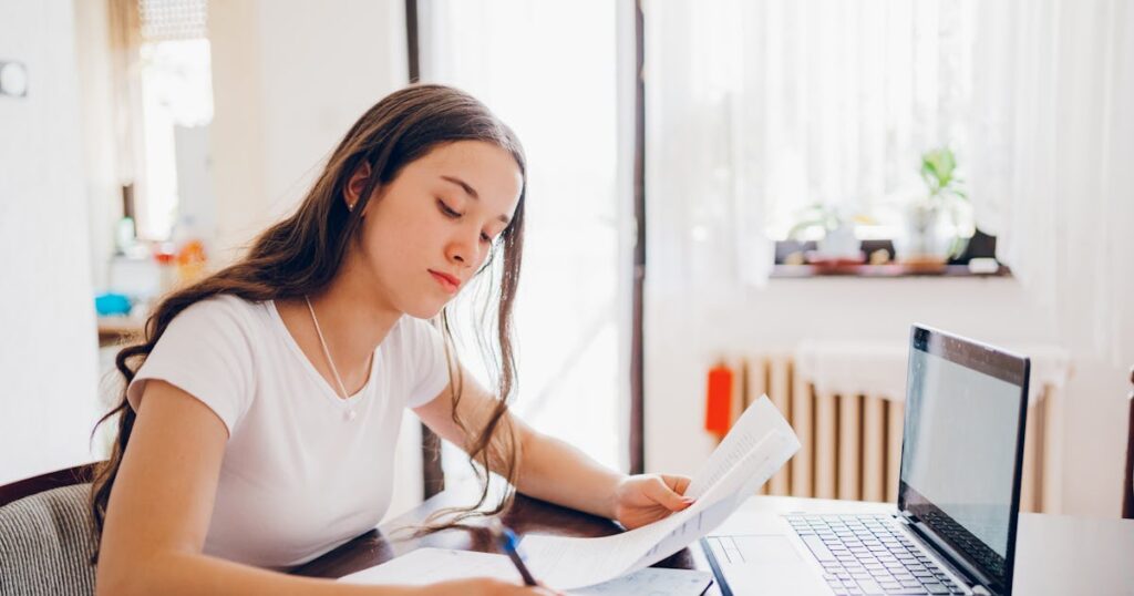 teenager girl studying at