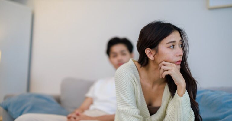 emotional asian couple expressing