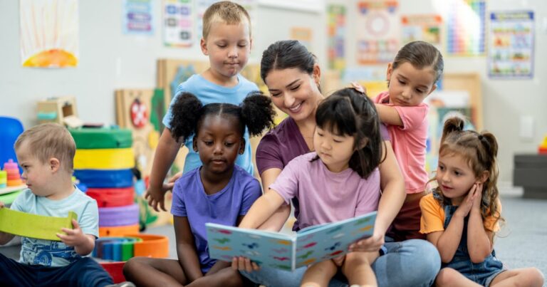 a kindergarten teacher sits