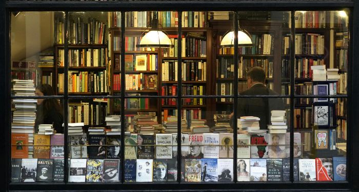 books and patrons through a bookstore window.jpg.optimal