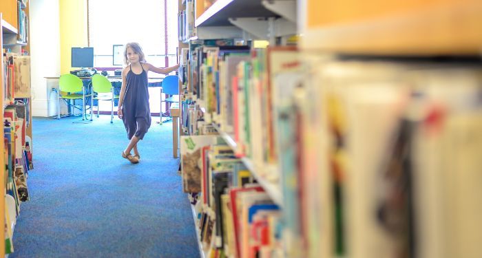 image of child in a school library.jpg.optimal